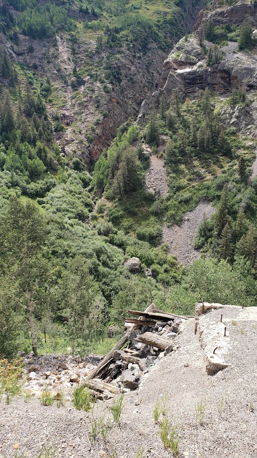 Foundation of Dunmore Mine tram tower (lower-right) alongside Highway 550 (photo by author, 2024).